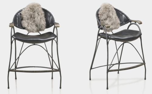 The Nomad Chair is a modern design with timeless features and rustic character. The hooped frame and petal-shaped seat take inspiration from the orchids and flowers of the forest. As comfortable on the mind as it is on the body. Superior natural materials (leather, wood, wool and hammered bronze) make it a tactile treat. The hand detailing is highly intricate and the finishing meticulous. The chair is extended into a high dining option with a bronze stretcher